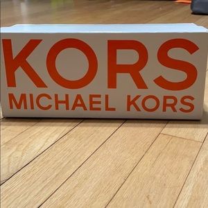 Neon Pink parent leather flats from Michael Kors.